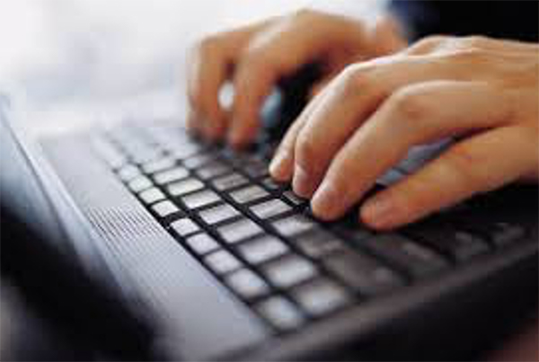 image of person typing on keyboard
